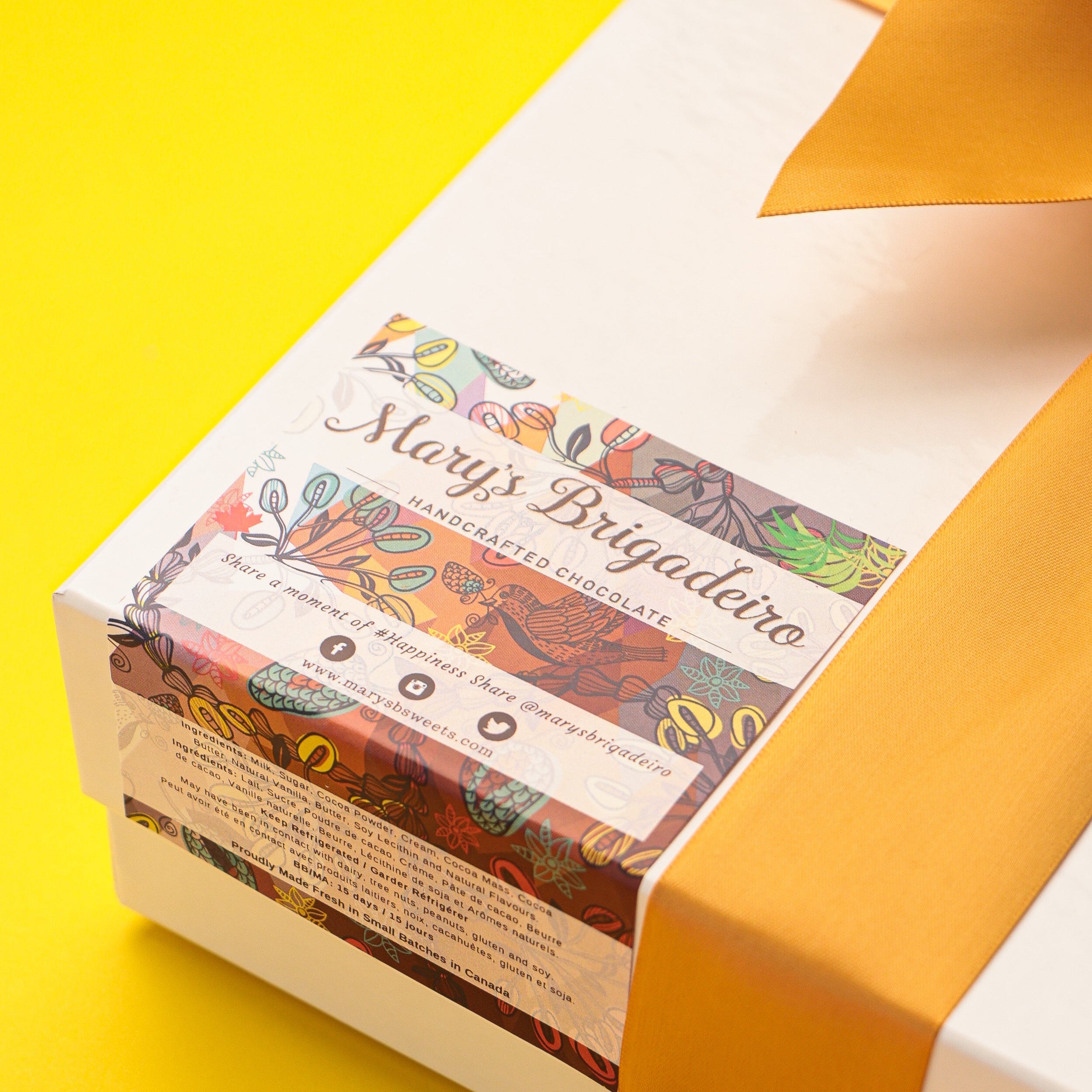 Gift box with a colorful label on a yellow background