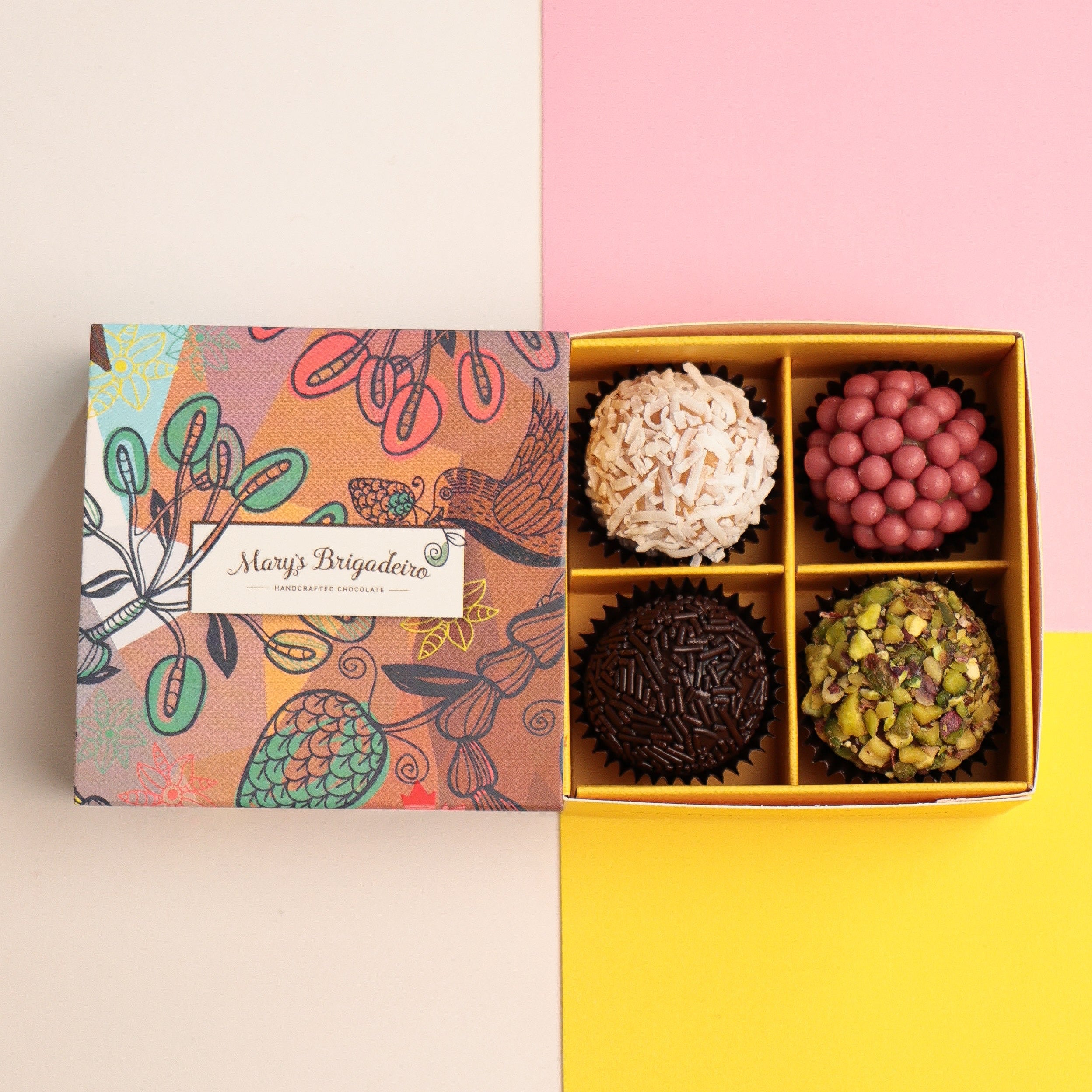Box of assorted 4 pieces Brigadeiro chocolates with a decorative box on a colorful background